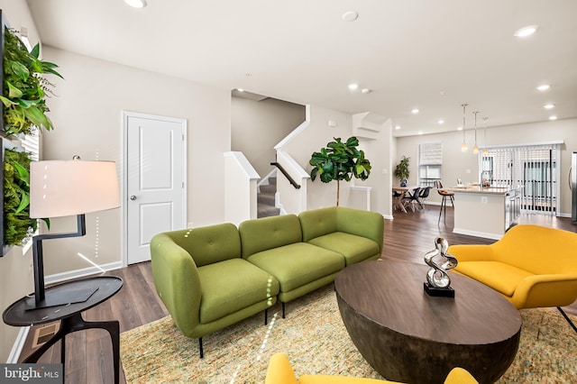 living room featuring dark wood-type flooring