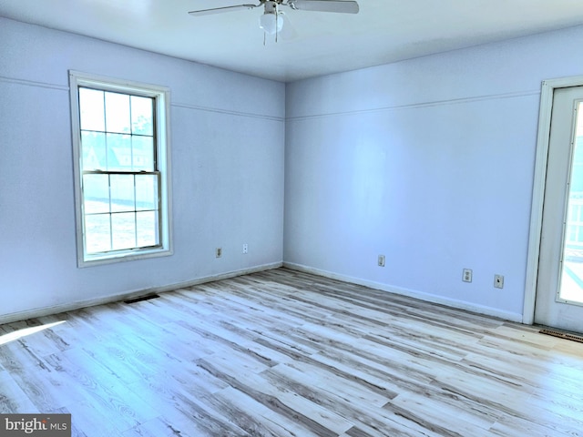 spare room with ceiling fan and light hardwood / wood-style flooring