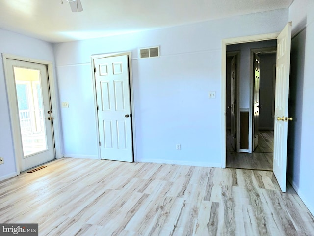 unfurnished room with light hardwood / wood-style flooring and ceiling fan