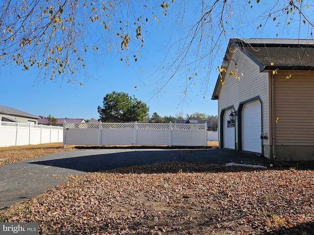 view of side of home with a garage