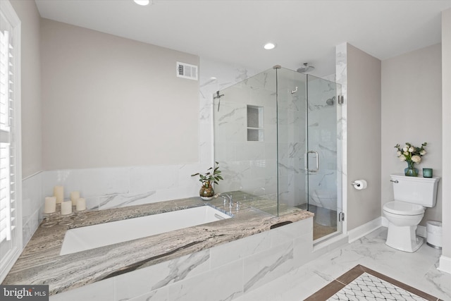 bathroom with visible vents, toilet, recessed lighting, a marble finish shower, and a garden tub