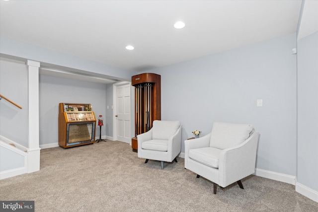 sitting room featuring recessed lighting, baseboards, stairs, and carpet floors