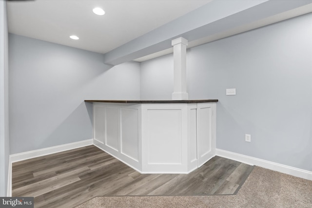 bar featuring recessed lighting, baseboards, and wood finished floors