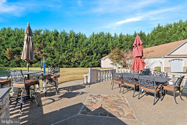 view of patio with outdoor dining space and an outdoor structure