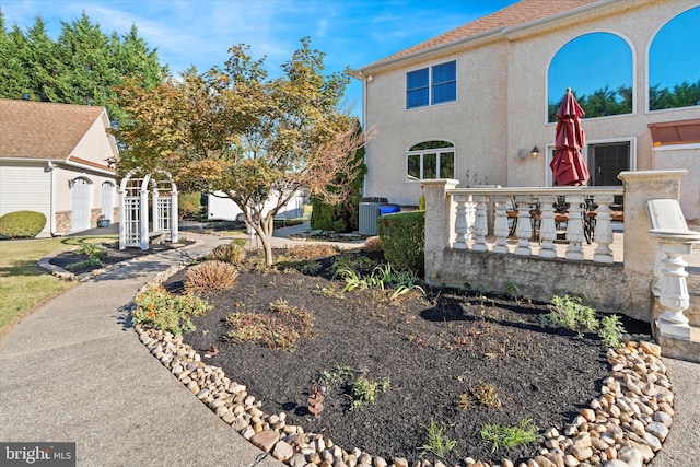 view of home's exterior featuring central air condition unit and stucco siding