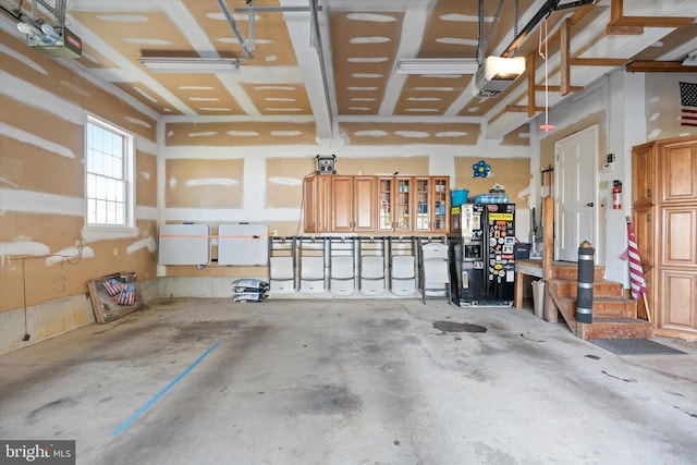 garage featuring visible vents and a garage door opener