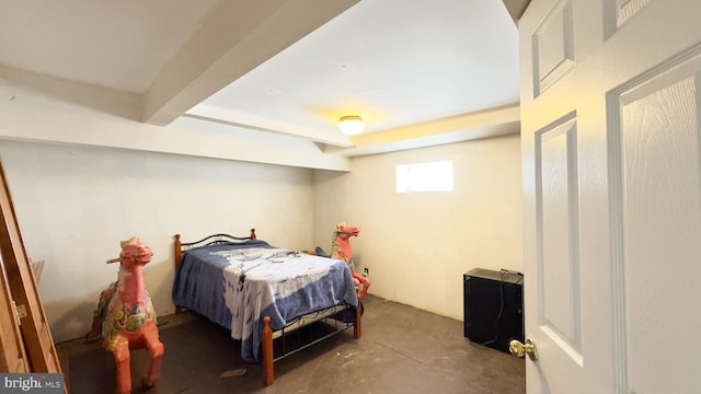 bedroom featuring concrete flooring