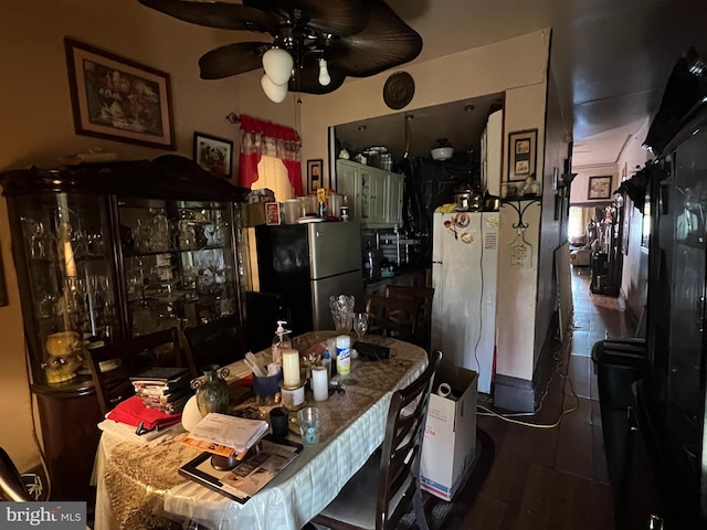 kitchen with ceiling fan, stainless steel fridge, white fridge, and hardwood / wood-style floors