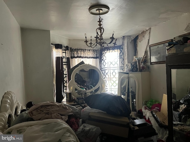 bedroom featuring a notable chandelier