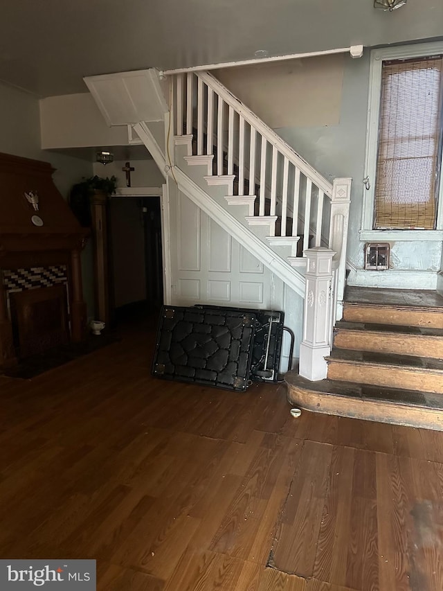 stairway featuring hardwood / wood-style flooring