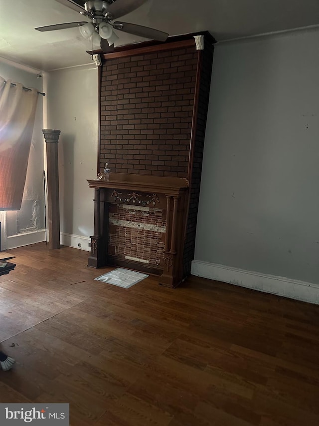 unfurnished living room featuring hardwood / wood-style floors, ceiling fan, and ornamental molding