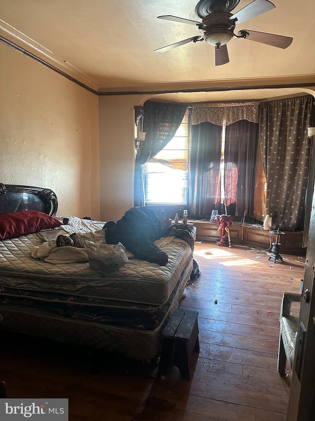 bedroom featuring hardwood / wood-style flooring and ceiling fan