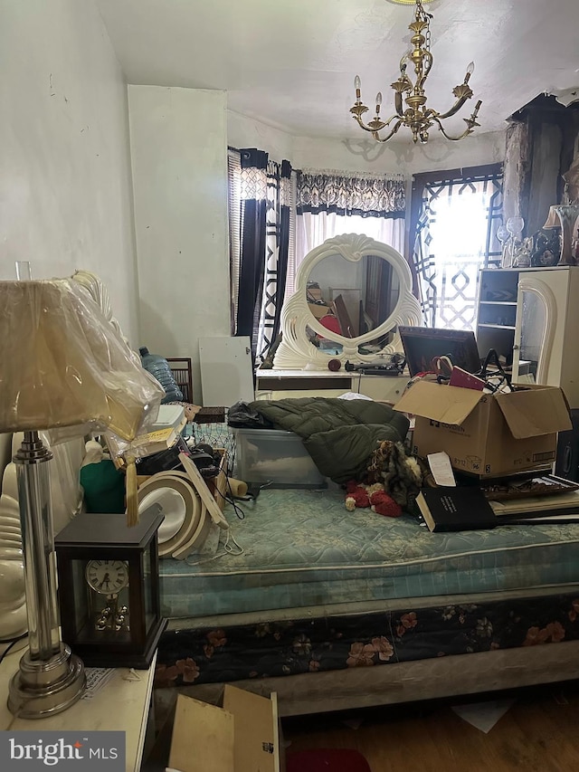 bedroom with a notable chandelier