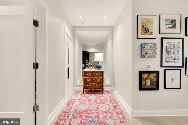 corridor featuring light hardwood / wood-style flooring