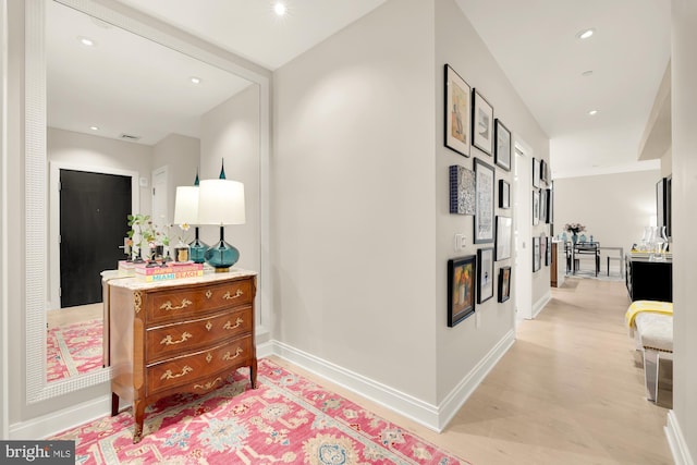 hall with light hardwood / wood-style flooring