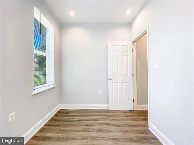 spare room with hardwood / wood-style floors