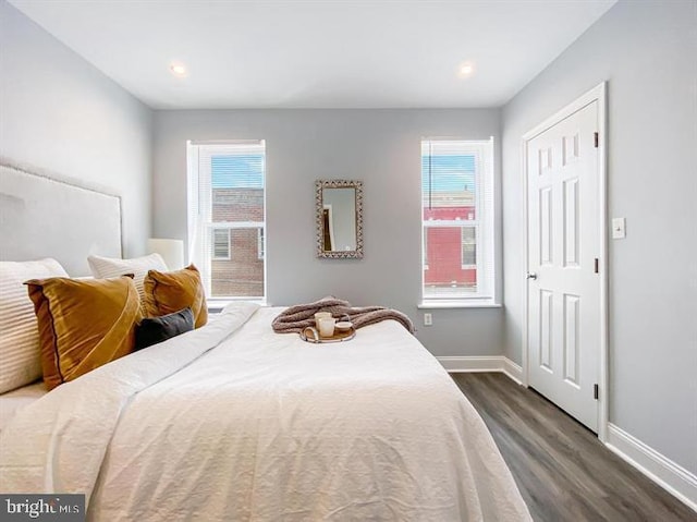 bedroom featuring dark hardwood / wood-style flooring