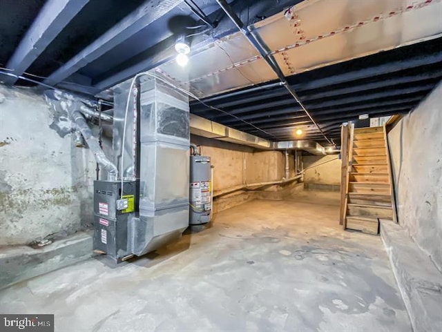 basement with gas water heater and heating unit