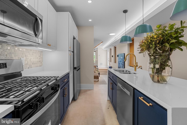 kitchen featuring tasteful backsplash, white cabinetry, appliances with stainless steel finishes, pendant lighting, and sink