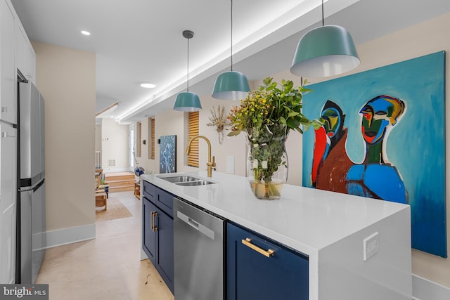 kitchen with a kitchen island, white cabinetry, appliances with stainless steel finishes, pendant lighting, and sink