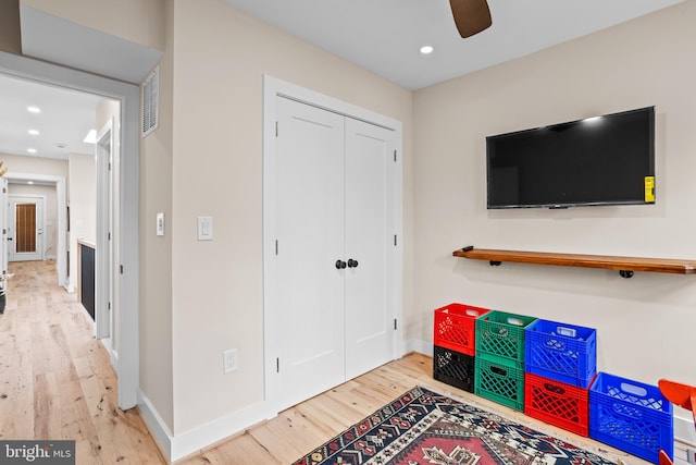 game room featuring light hardwood / wood-style floors and ceiling fan