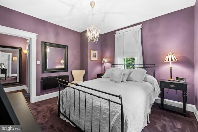 carpeted bedroom with an inviting chandelier