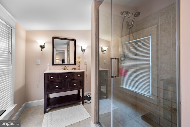 bathroom with tile patterned floors, vanity, lofted ceiling, and walk in shower