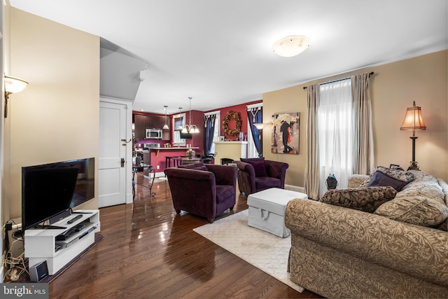 living room with dark hardwood / wood-style floors