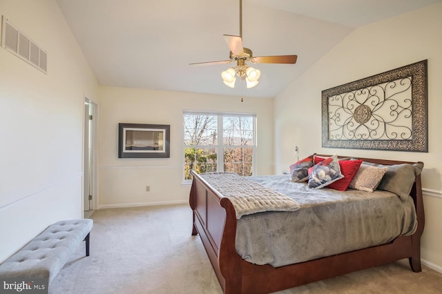 bedroom with lofted ceiling, baseboards, visible vents, and light colored carpet