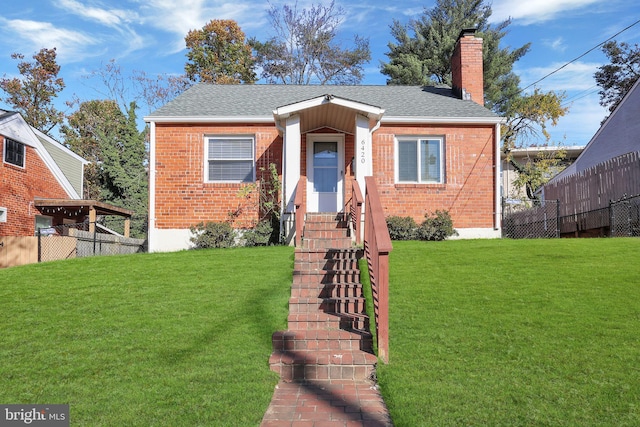 bungalow-style home featuring a front lawn