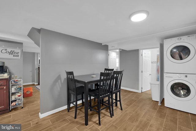 laundry area with stacked washer and clothes dryer