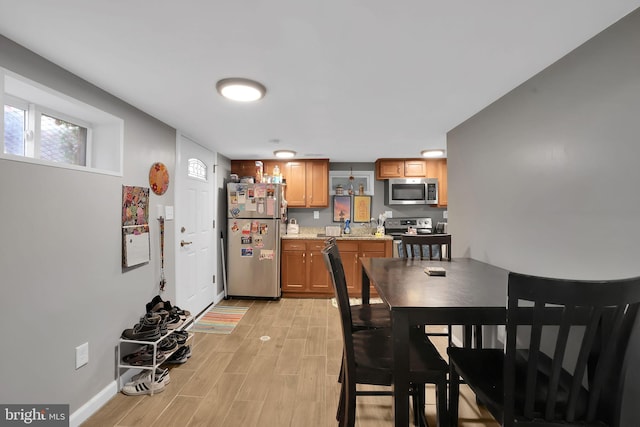 dining area with light wood-type flooring