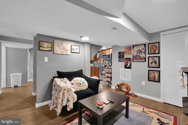 living room with light hardwood / wood-style flooring