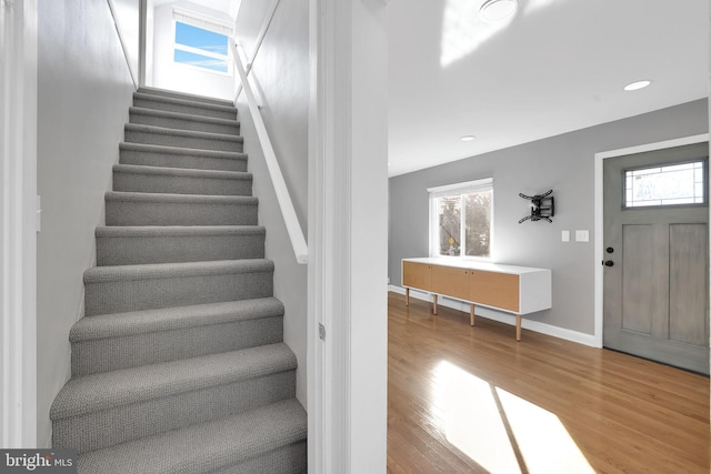 foyer entrance featuring hardwood / wood-style flooring and a healthy amount of sunlight