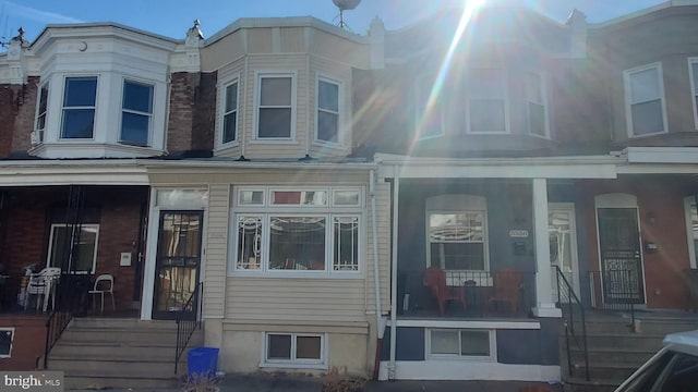 view of property exterior with a porch