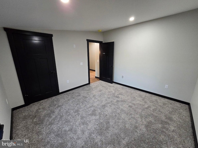 unfurnished bedroom featuring light carpet