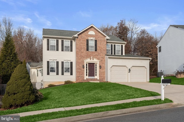 colonial house featuring a garage, central AC, brick siding, driveway, and a front yard