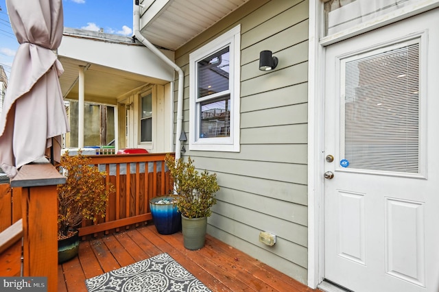 entrance to property with a wooden deck