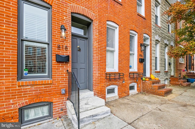 property entrance featuring a patio