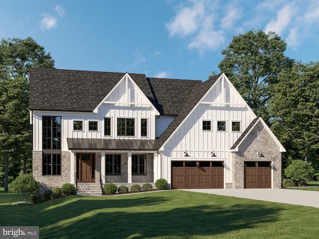 view of front of home with a garage and a front yard