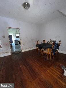 unfurnished dining area featuring dark hardwood / wood-style flooring