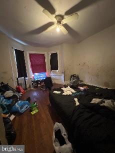 bedroom with hardwood / wood-style floors and ceiling fan