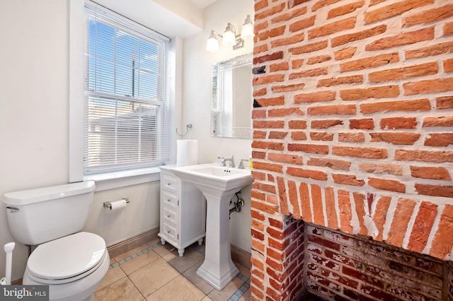 bathroom with tile patterned floors and toilet