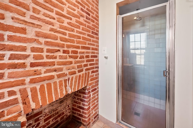 bathroom with brick wall