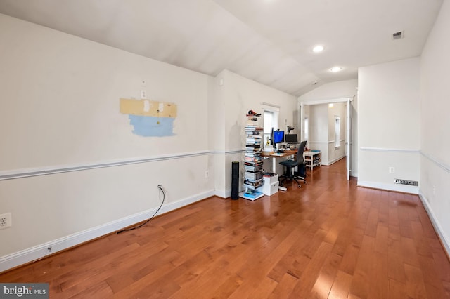 office space featuring hardwood / wood-style flooring and vaulted ceiling