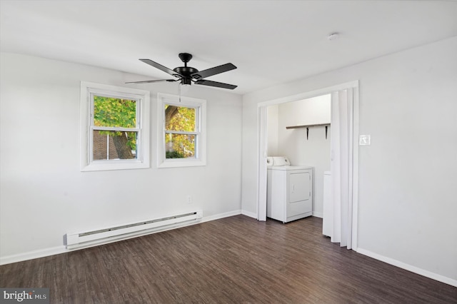 spare room featuring ceiling fan, independent washer and dryer, dark hardwood / wood-style floors, and a baseboard heating unit