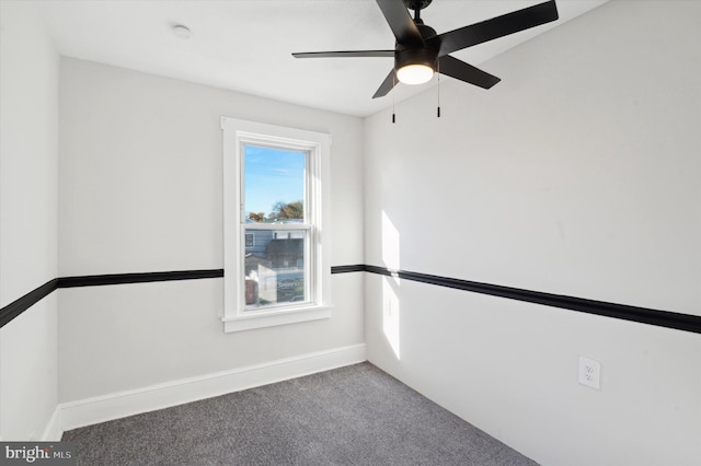 spare room featuring ceiling fan and carpet flooring