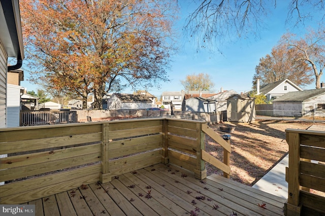 wooden terrace with a shed