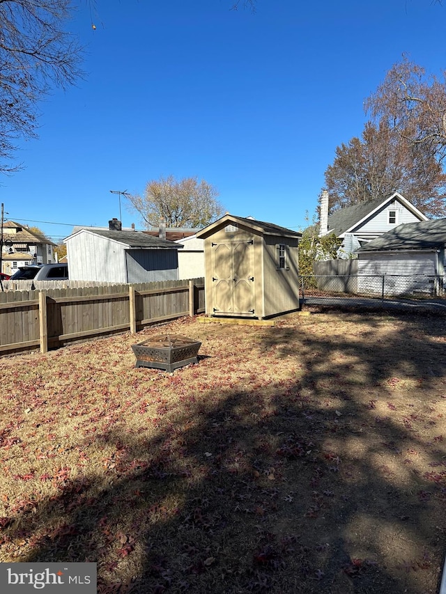 back of house with a shed