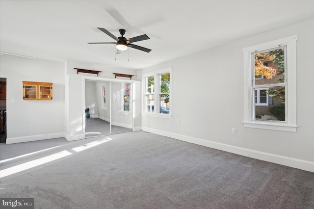 interior space with ceiling fan